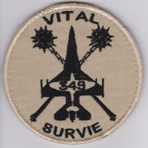 A patch with the word vital survive on it.