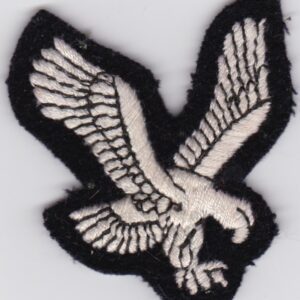 A black and white eagle embroidered on a white surface.