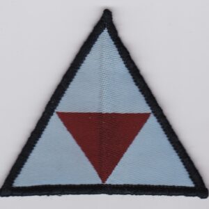 A triangle shaped patch on a white surface.