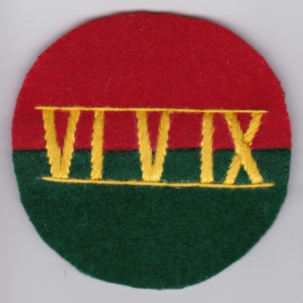 A red and green badge with the numeral viii on it.