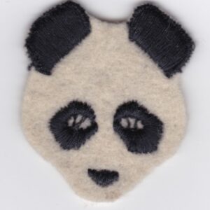 A panda bear shaped felt applique on a white surface.