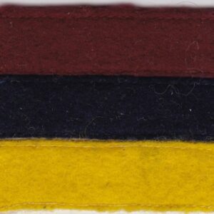 A red, yellow, and blue felt patch.