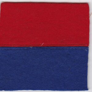 A red and blue felt square on a white surface.