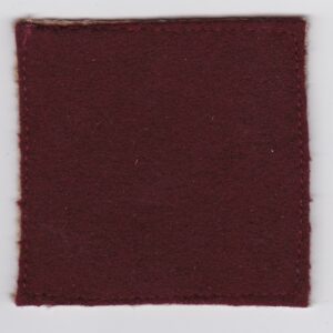 A square piece of burgundy felt on a white surface.