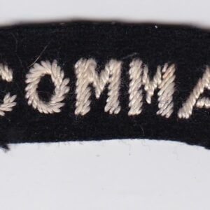 A badge with the word n9 commando on it.