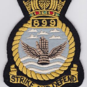 A badge with the words'strike and defend'on it.