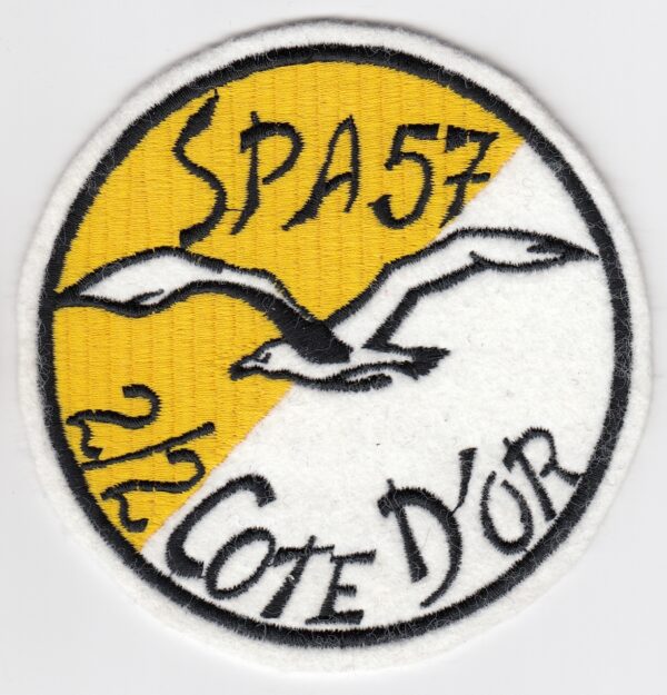 A yellow and white patch with a bird on it.