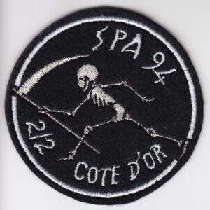 A patch with a skeleton and a scythe on it.