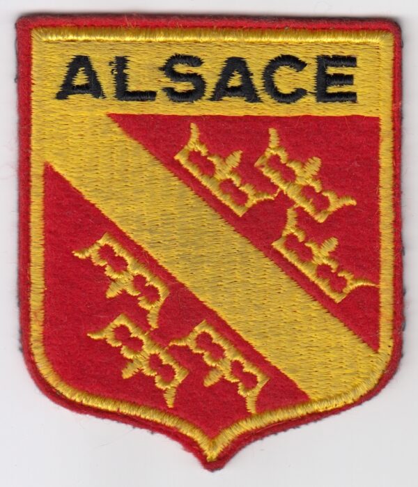 A red and yellow patch with the word alascae on it.