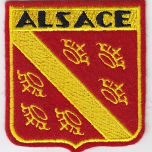 A red and yellow patch with the word alascae on it.