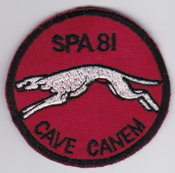 A red patch with a greyhound on it.