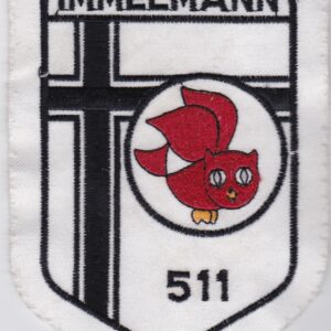 A badge with an owl on it.