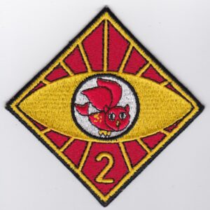 A red and yellow patch with an owl on it.