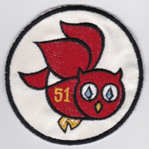 A red and yellow owl patch with the number 51 on it.