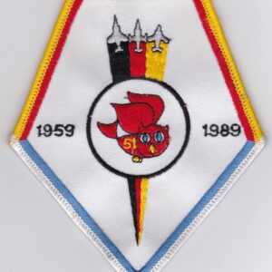 A patch with a red, white and blue design.