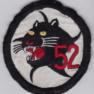 A black and white patch with the number 52 on it.