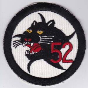 A black and white patch with the number 52 on it.