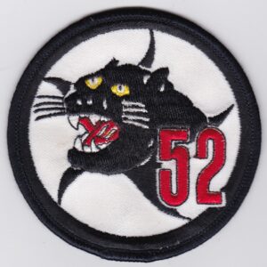 A patch with the number 52 on it.