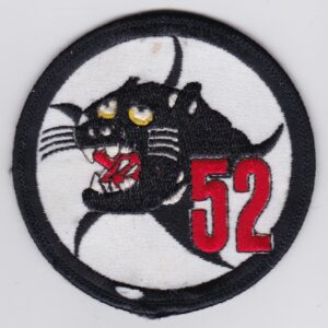 A patch with the number 52 on it.