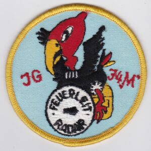 A round patch with a red bird on it.