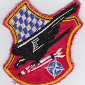 A patch with an eagle and a rocket on it.