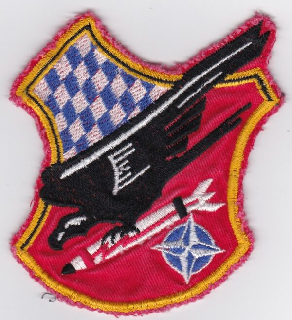 A patch with an eagle and a rocket on it.