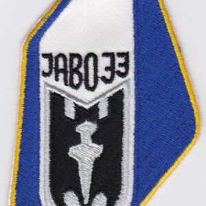 A blue and white patch with the word eodal on it.