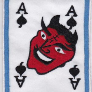 A patch with a devil face on it.