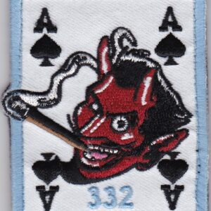 A patch with an image of a devil playing cards.