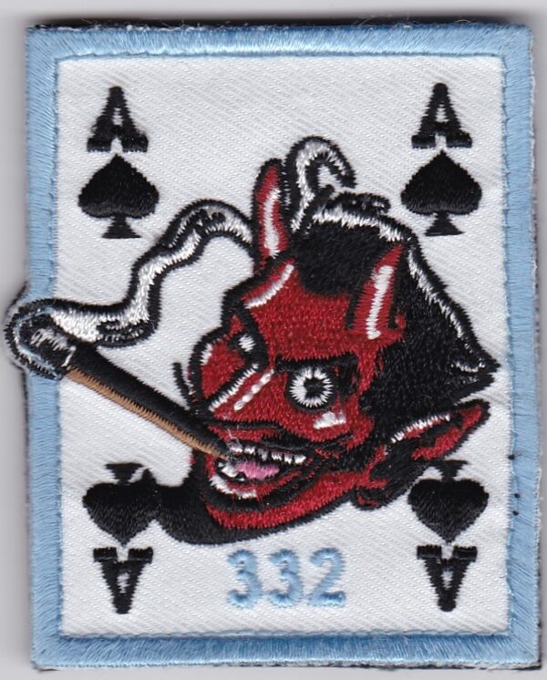 A patch with an image of a devil playing cards.