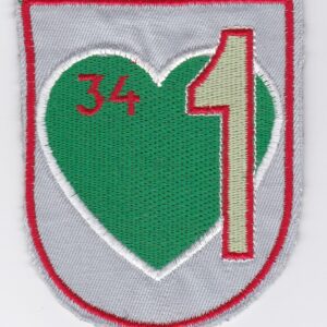 A green and red heart shaped patch with the number 34 on it.