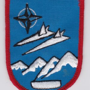 A patch with two planes and a mountain on it.