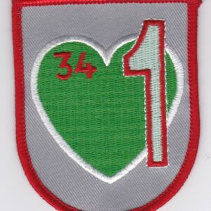 A heart shaped patch with the number 34 on it.