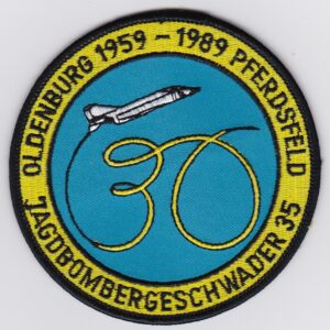 A patch with an image of a plane flying in the sky.