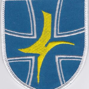 A blue and yellow patch with a cross on it.