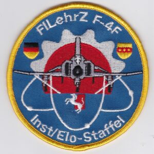 A patch with a picture of a jet fighter.