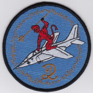 A patch with an image of a devil riding a jet.