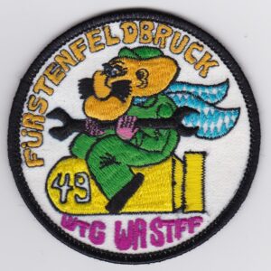 A patch with an image of a man with a gun.