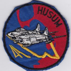 A patch with the word husum on it.