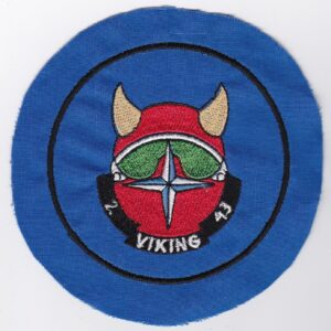 A blue patch with a viking helmet on it.