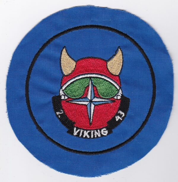 A blue patch with a viking helmet on it.