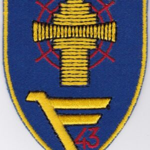 A blue and yellow patch with a cross on it.