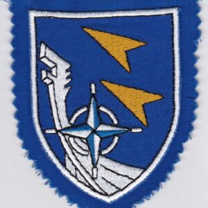 A blue and yellow patch with a compass on it.