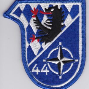 A blue and white patch with a griffin on it.