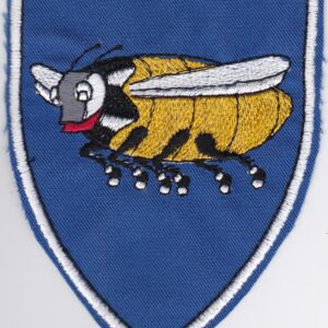 A badge of blue color with a bee on it.