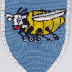 A badge of blue color with a bee on it.