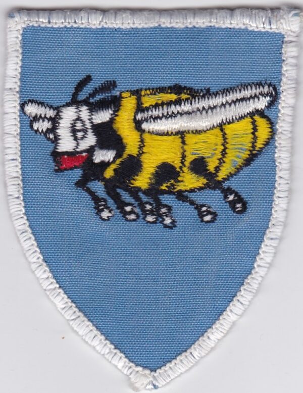 A badge of blue color with a bee on it.