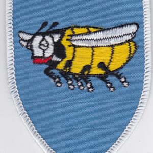 A blue color patch with a bee on it.