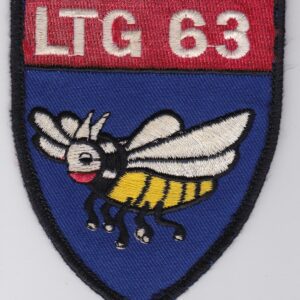 A blue and red patch of LTG 63 with a bee on it.