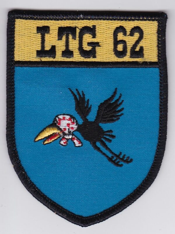 A blue patch with a bird and the word ltg 62 on it.